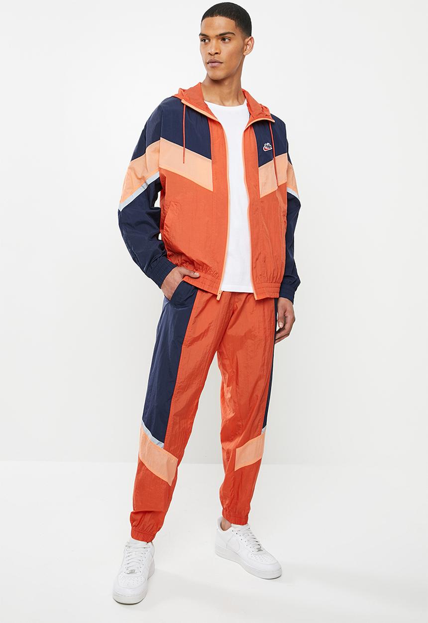 Nike - Nike sportswear he wr+ unld woven pants - orange & navy