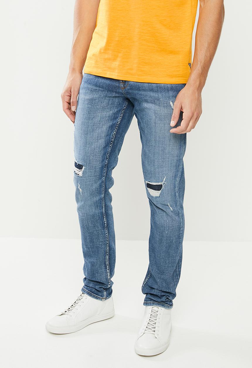 GUESS - Mid wash slim taper with rips - mid blue