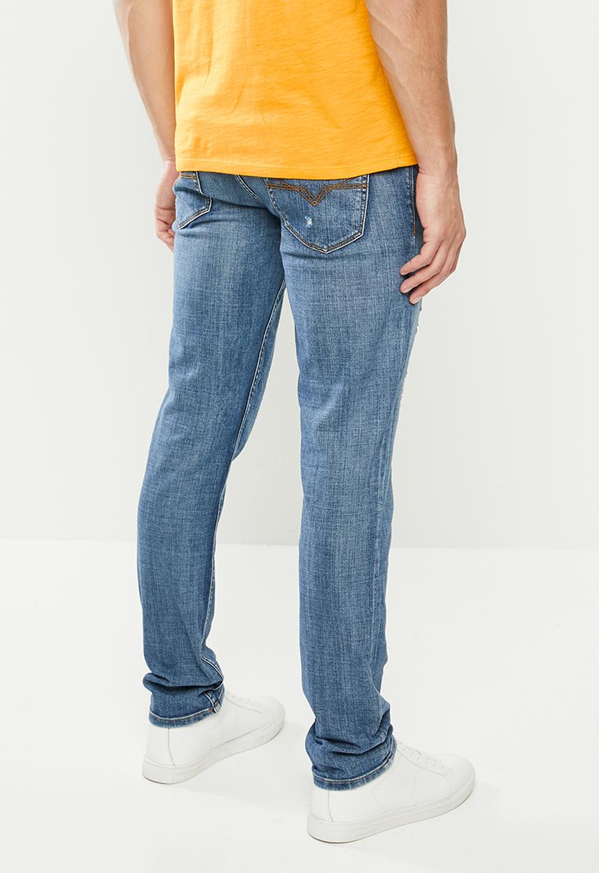 GUESS - Mid wash slim taper with rips - mid blue