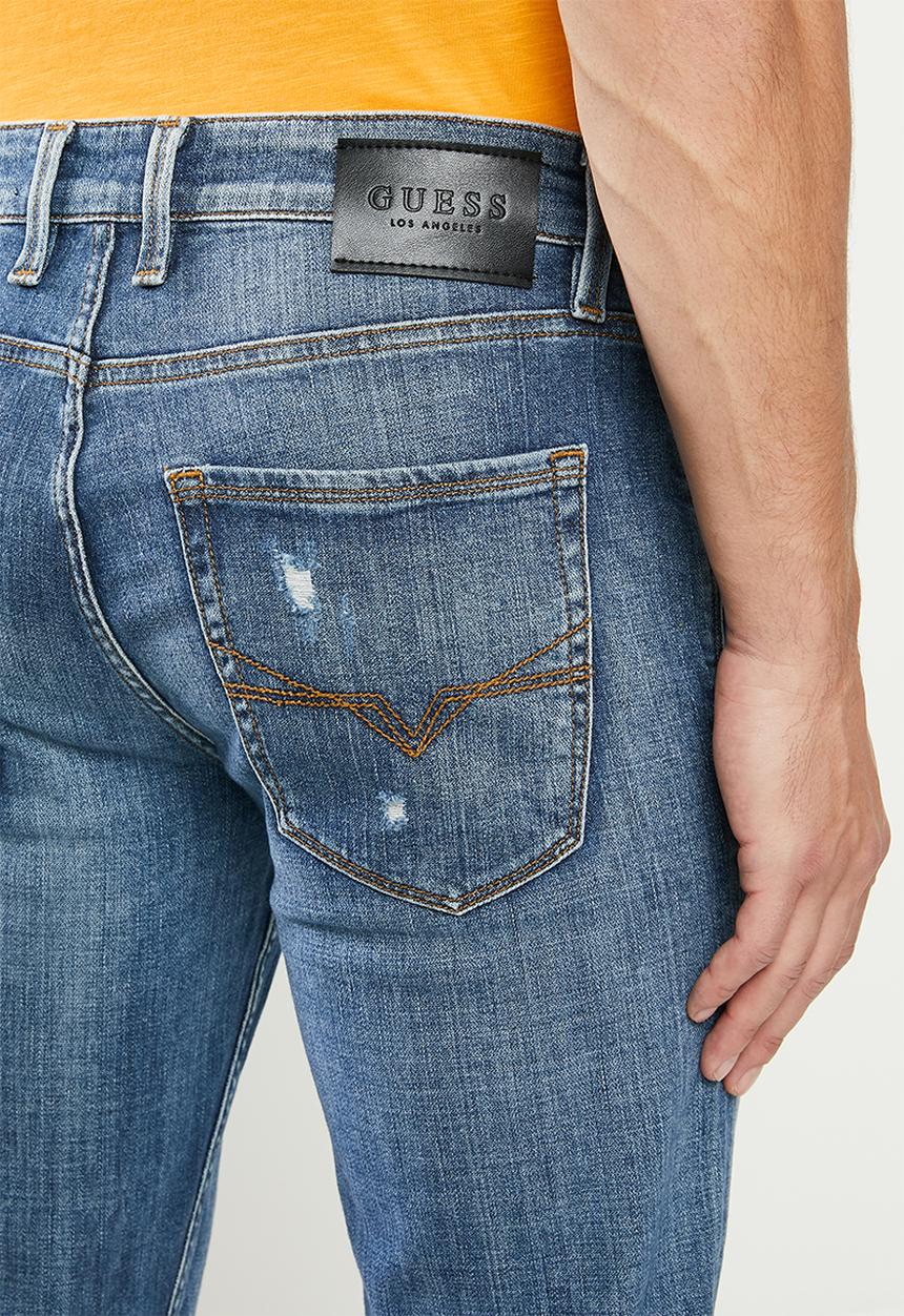 GUESS - Mid wash slim taper with rips - mid blue