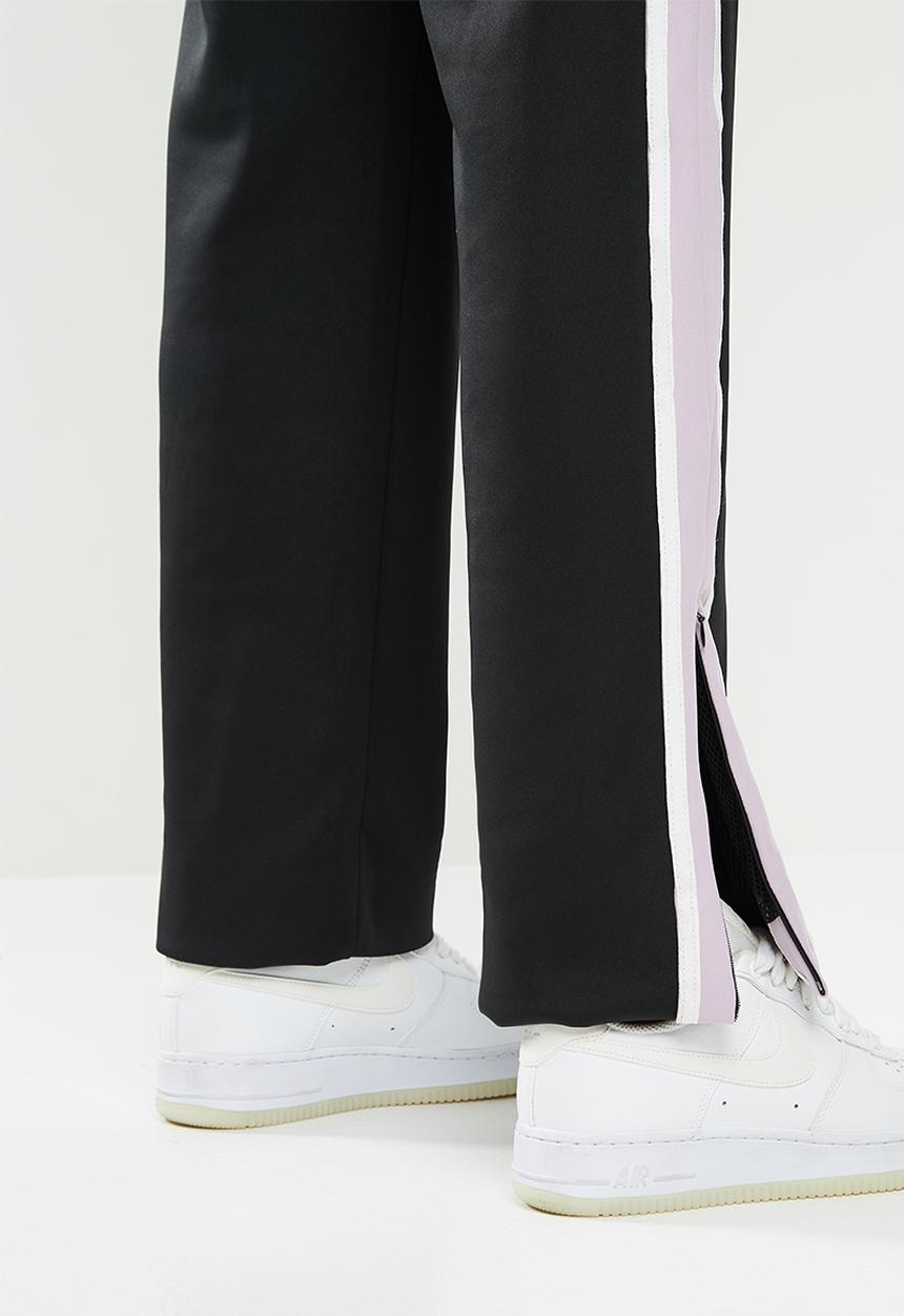 SISSY BOY - Track pants with zippable ankle areas - black & lilac