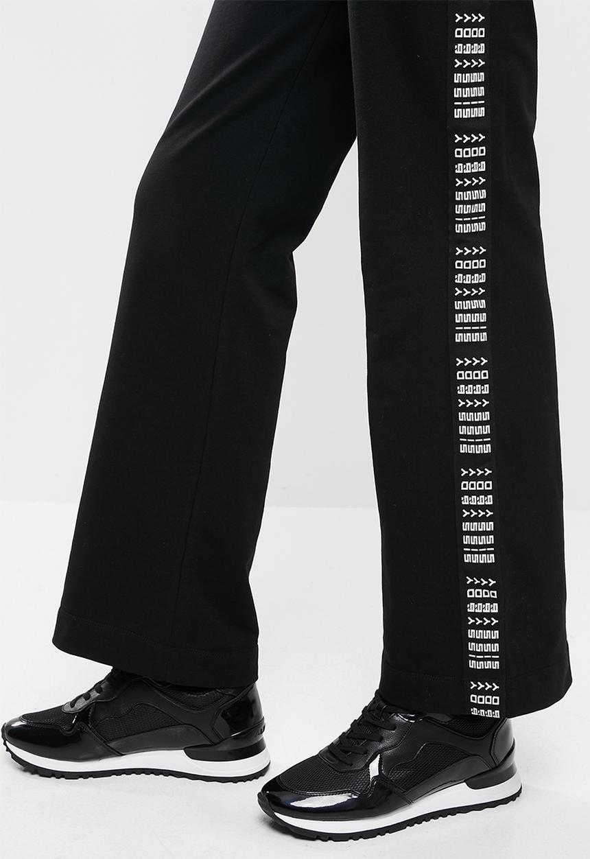 SISSY BOY - Flared sweatpants - black