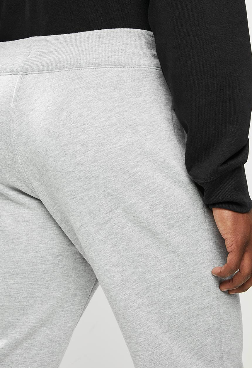 New Balance  - New Balance classics core pant - grey 
