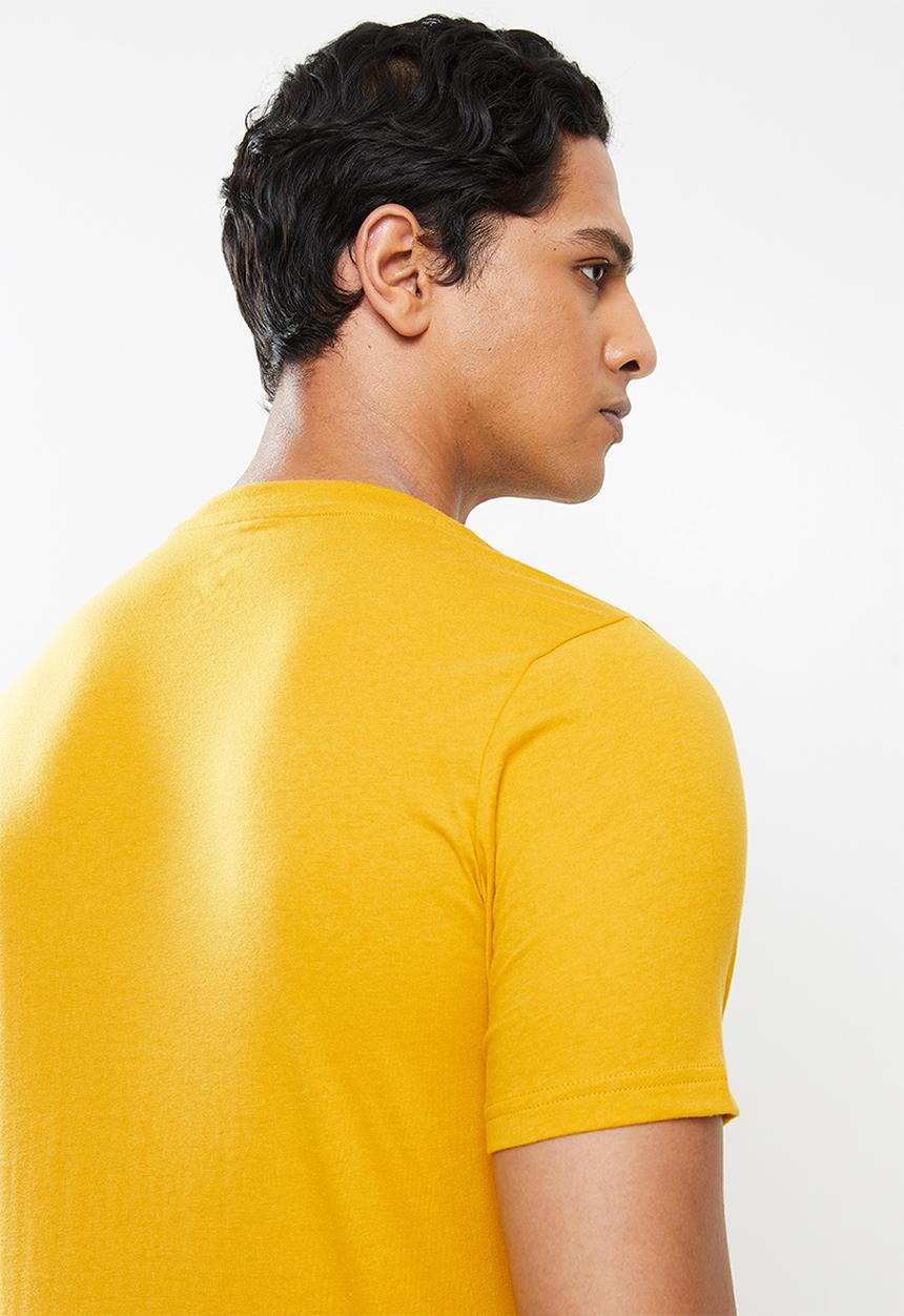 New Balance  - Nb classics graphic tee - varsity gold