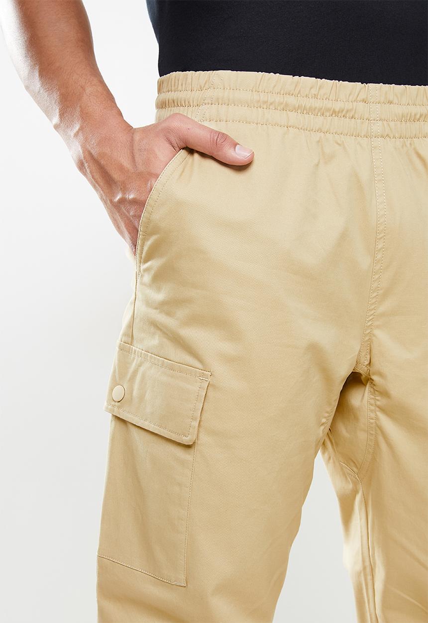New Balance  - Nb athletics higher learning woven cargo pant - incense