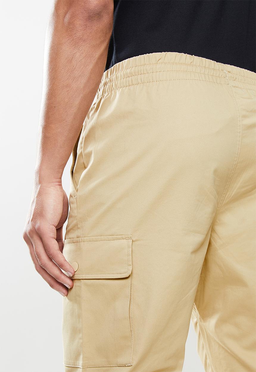 New Balance  - Nb athletics higher learning woven cargo pant - incense