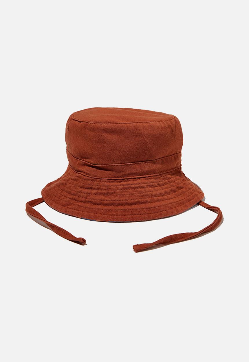 Cotton On - Reversible bucket hat - chutney dusk/blue dino