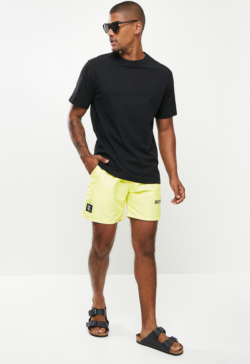 Butan - Aluta block letters shorts - pastel yellow
