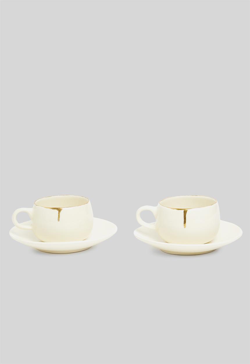 Urchin Art - Set of two cirilla cup & saucer- cream & gold