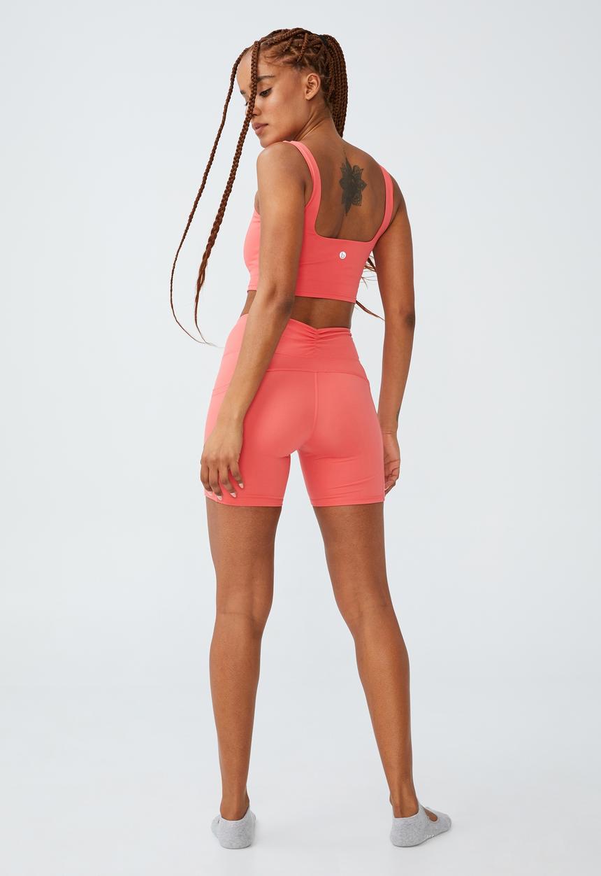 Cotton On - Ultra soft booty lift pocket bike short - coral burst
