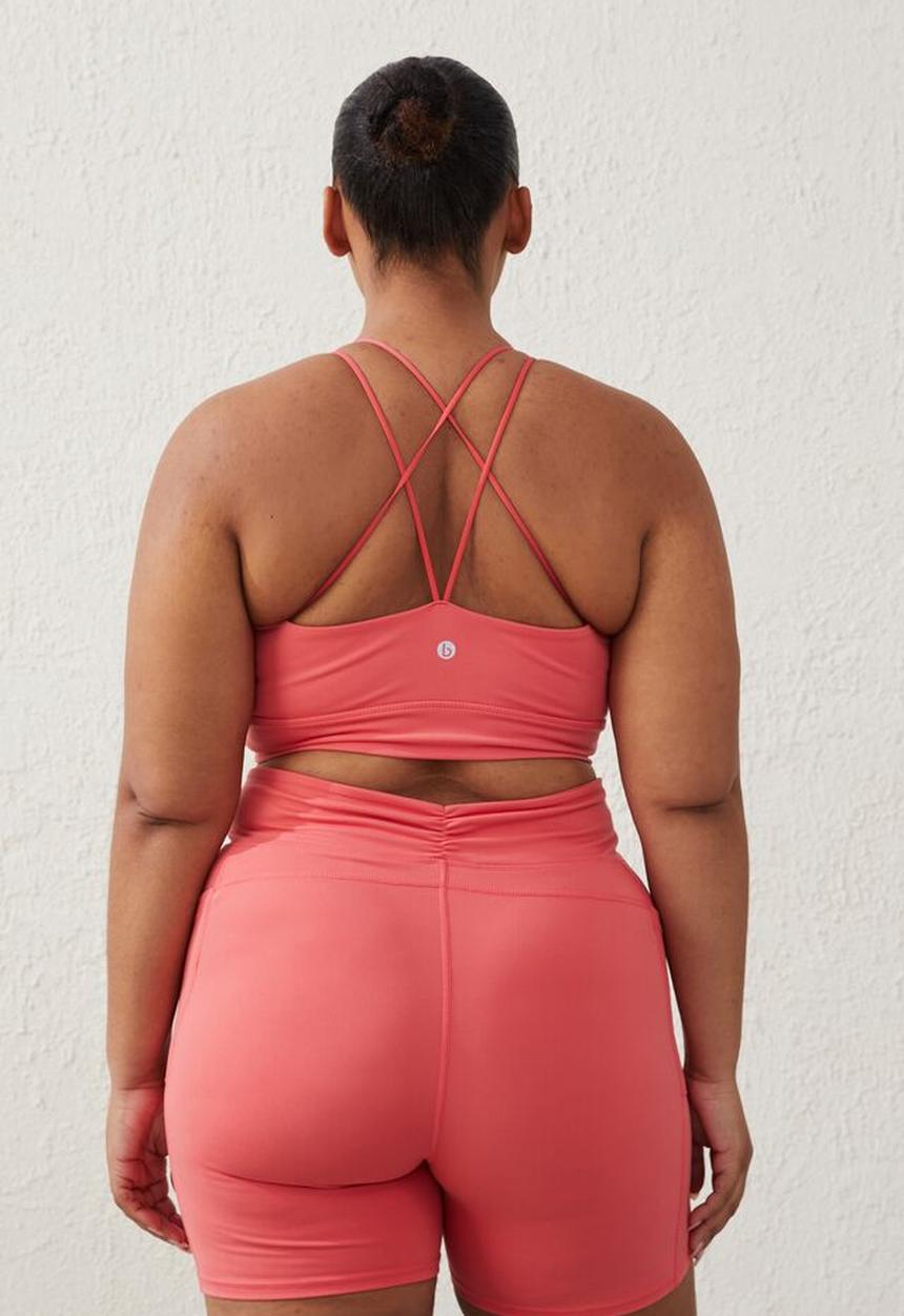 Cotton On - Curve active  recycled ruched strappy crop - coral burst