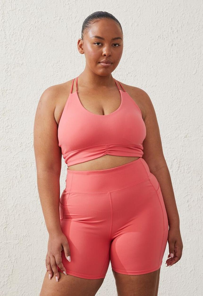 Cotton On - Curve active  recycled ruched strappy crop - coral burst
