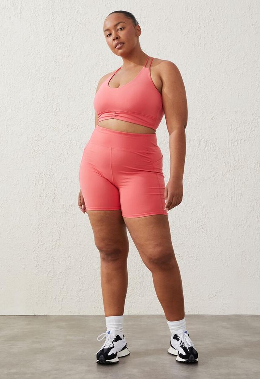 Cotton On - Curve active  recycled ruched strappy crop - coral burst