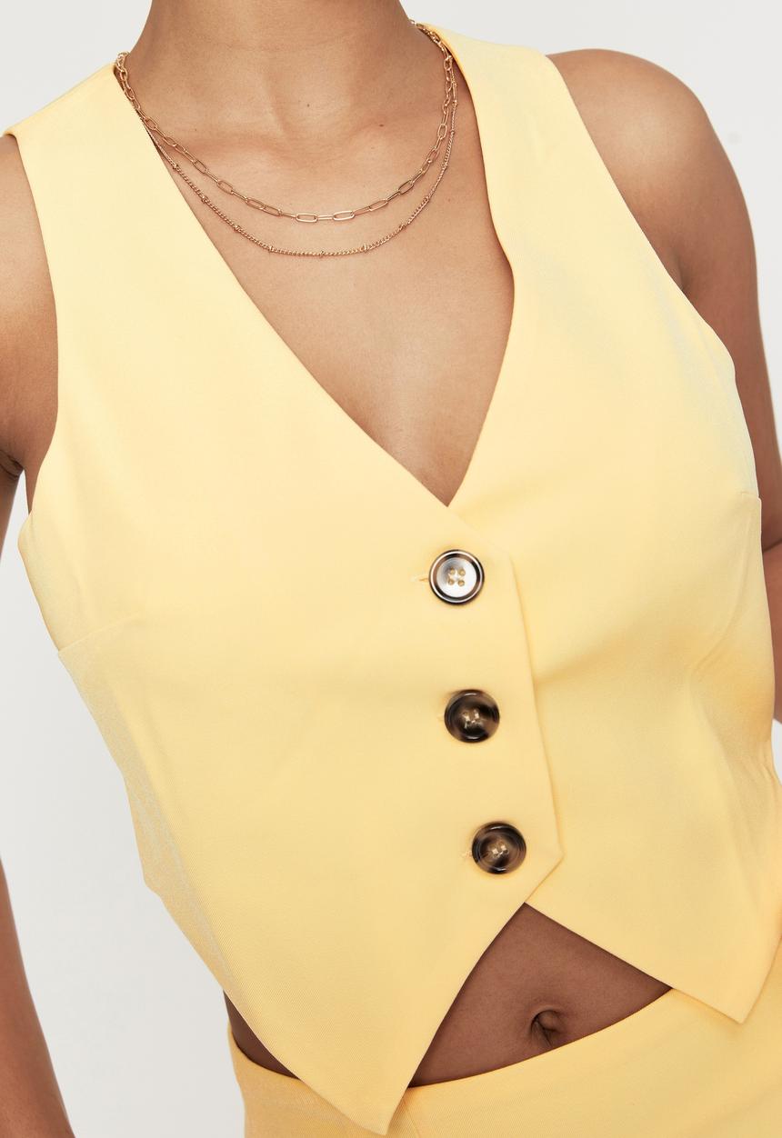 Supré  - Indigo sleeveless waistcoat - banana