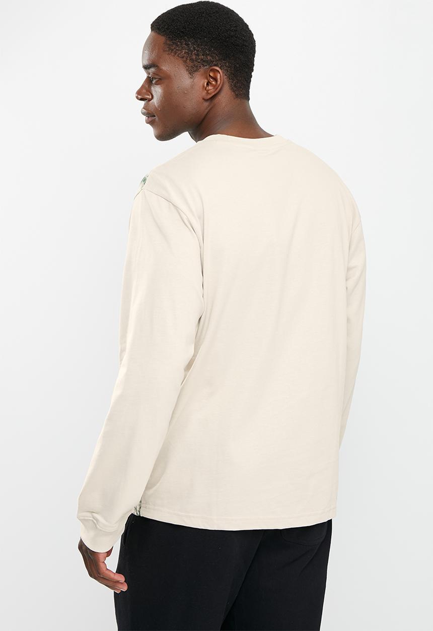 New Balance  - Nb at graphic long sleeve - timberwolf
