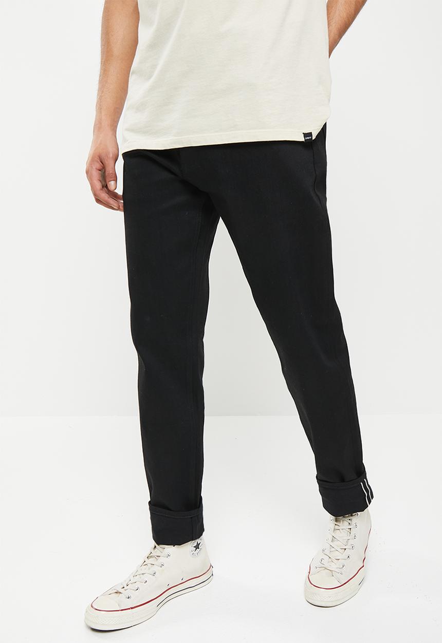 THE UNBRANDED BRAND - Relaxed tapered fit 11 oz solid black stretch selvedge denim
