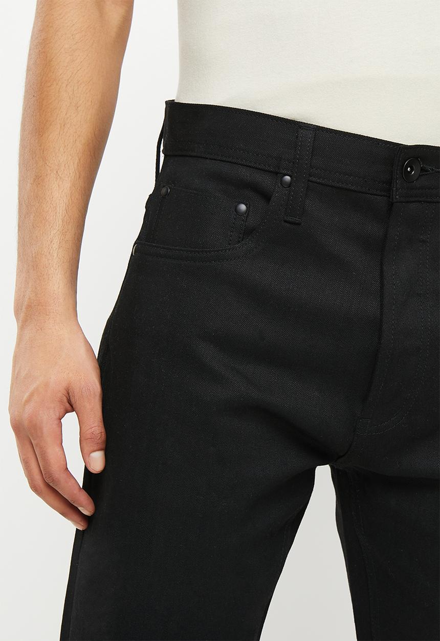 THE UNBRANDED BRAND - Relaxed tapered fit 11 oz solid black stretch selvedge denim