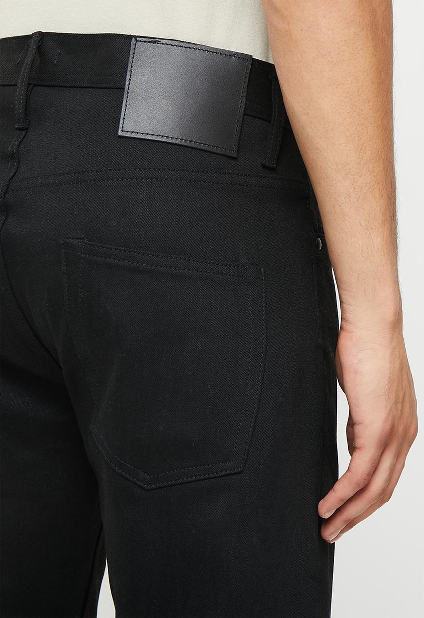 THE UNBRANDED BRAND - Relaxed tapered fit 11 oz solid black stretch selvedge denim