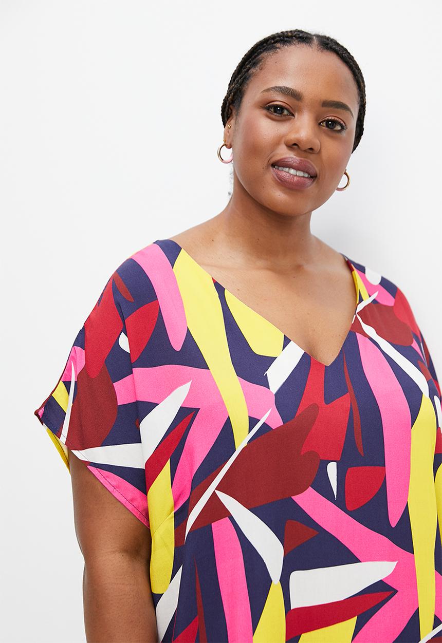 edit Plus - V-neck curved hem tunic - bold abstract leaves