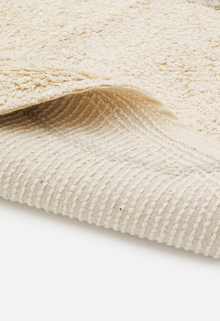Sixth Floor - Linear tufted round rug - natural