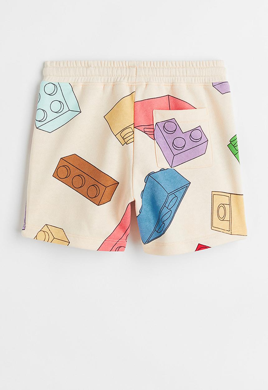 H&M - Patterned sweatshorts - light yellow/lego® collection