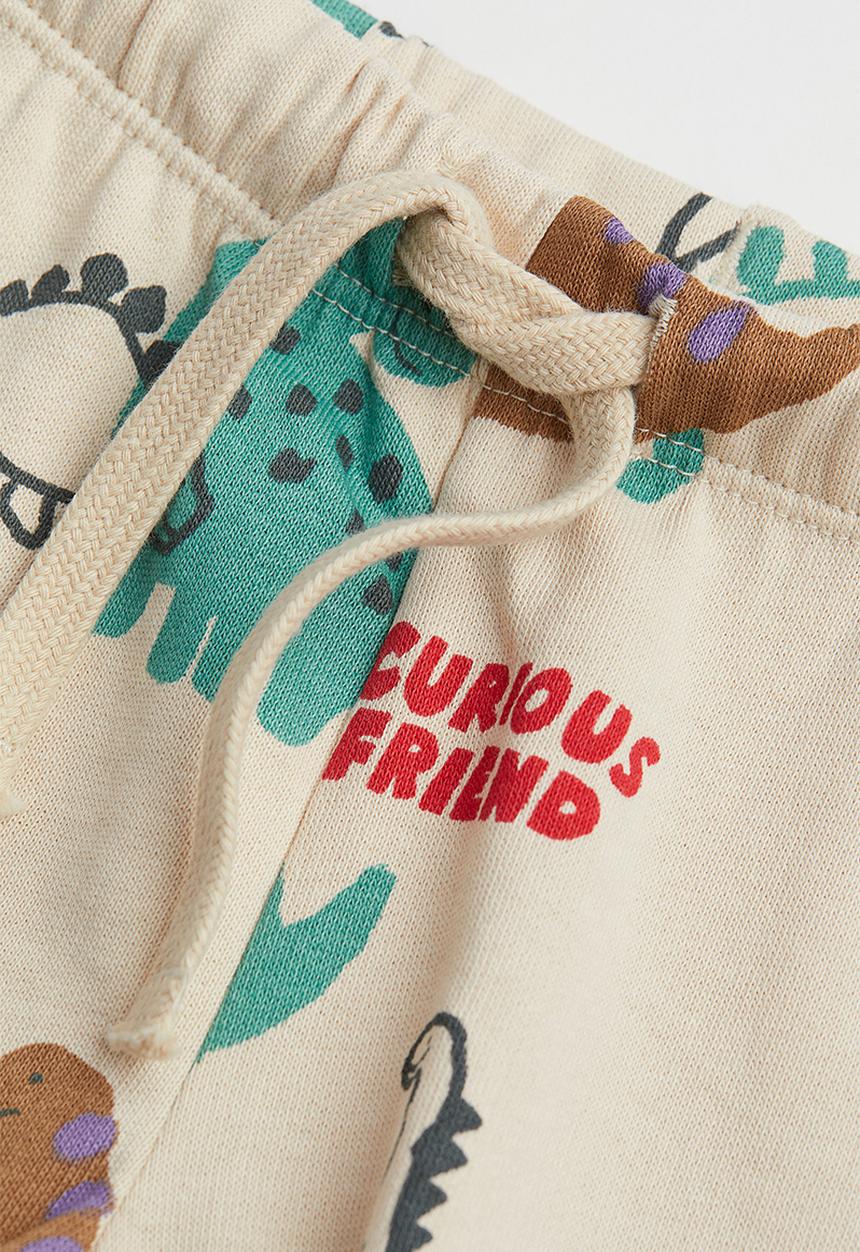 H&M - Cotton joggers - light beige/dinosaurs