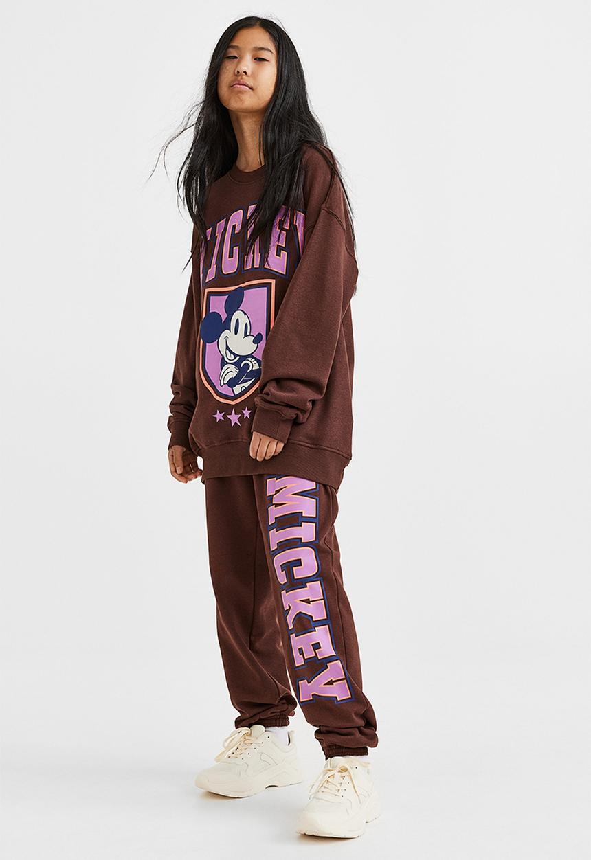 H&M - Printed joggers - dark brown/mickey mouse