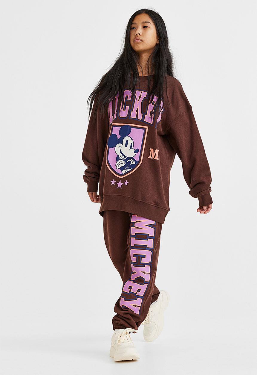H&M - Printed joggers - dark brown/mickey mouse