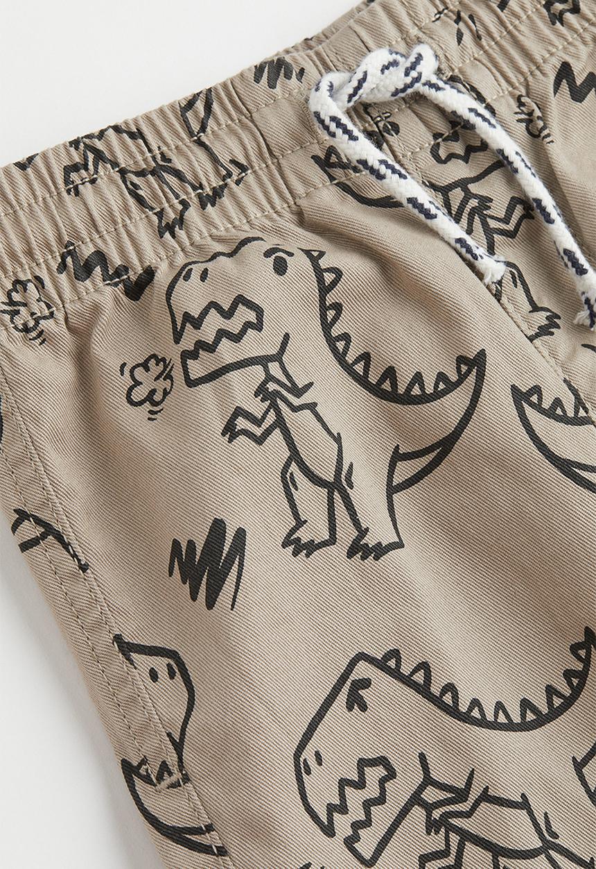 H&M - Relaxed fit joggers - beige/dinosaurs