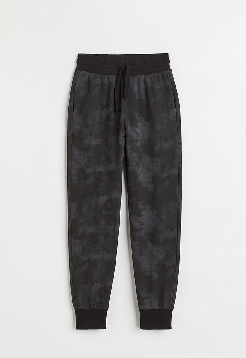H&M - Printed joggers - black/tie-dye