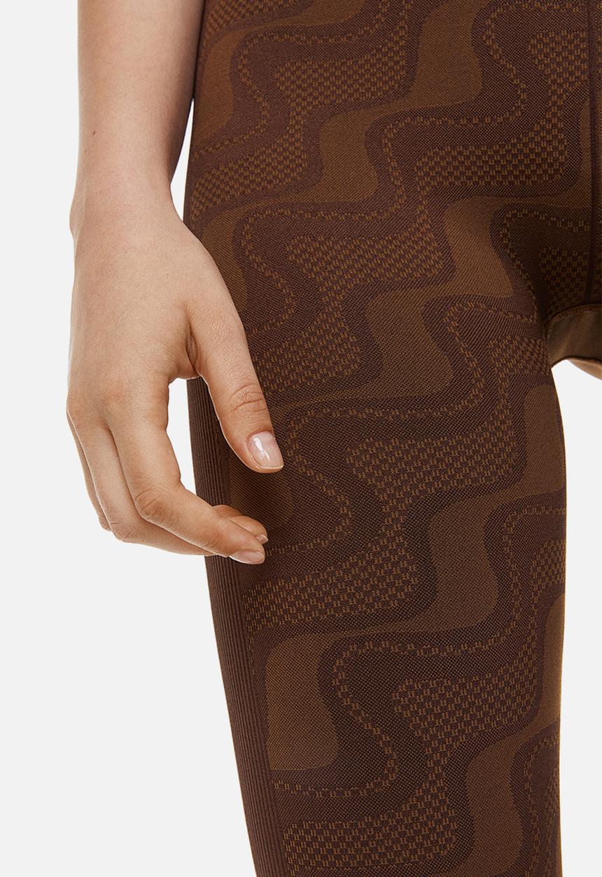 H&M - Seamless sports tights - dark brown/patterned