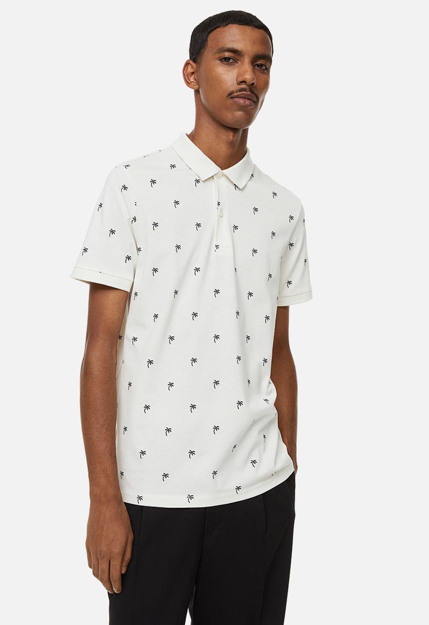 H&M - Slim fit patterned polo shirt - cream/palm trees