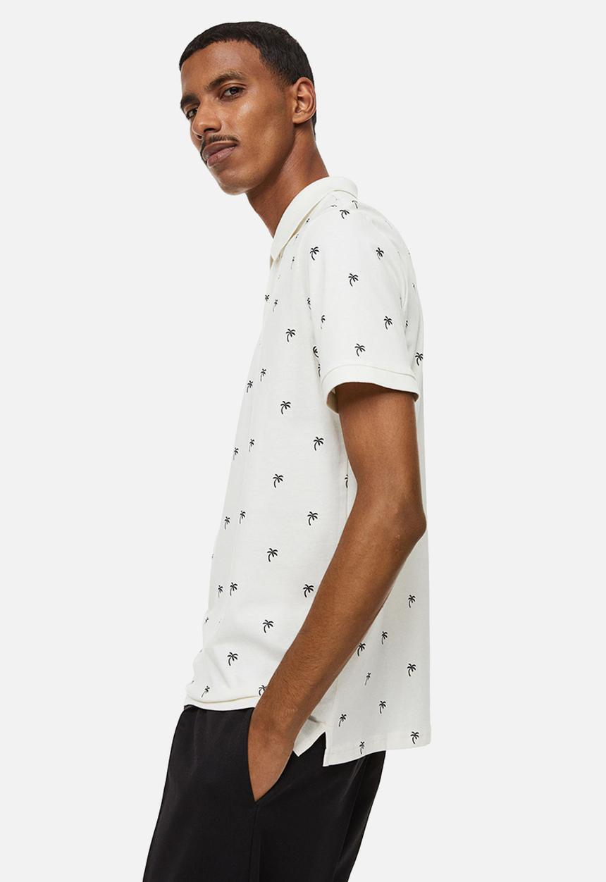 H&M - Slim fit patterned polo shirt - cream/palm trees