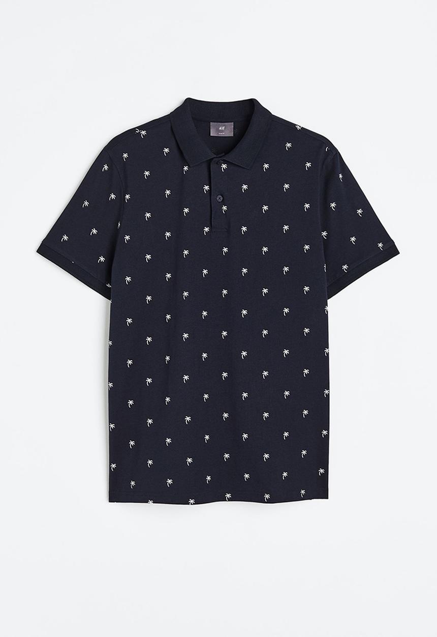 H&M - Slim fit patterned polo shirt - dark blue/palm trees