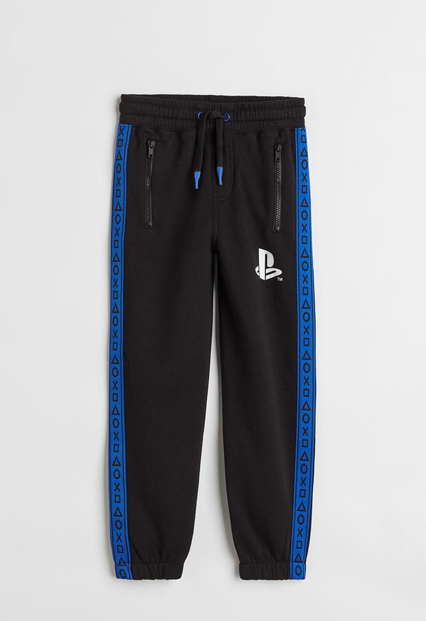 H&M - Printed joggers - black/playstation