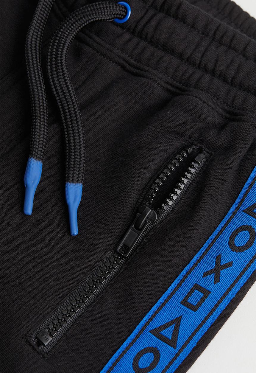 H&M - Printed joggers - black/playstation