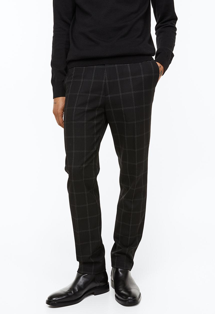 H&M - Slim fit trousers - black/checked
