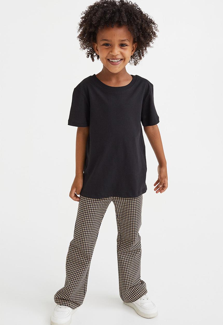 H&M - Flared leggings - beige/dogtooth-patterned