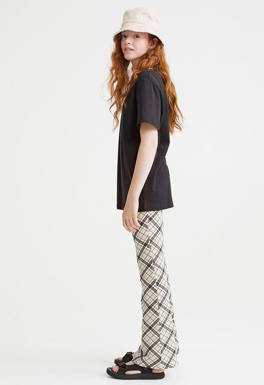 H&M - Flared leggings - beige/checked