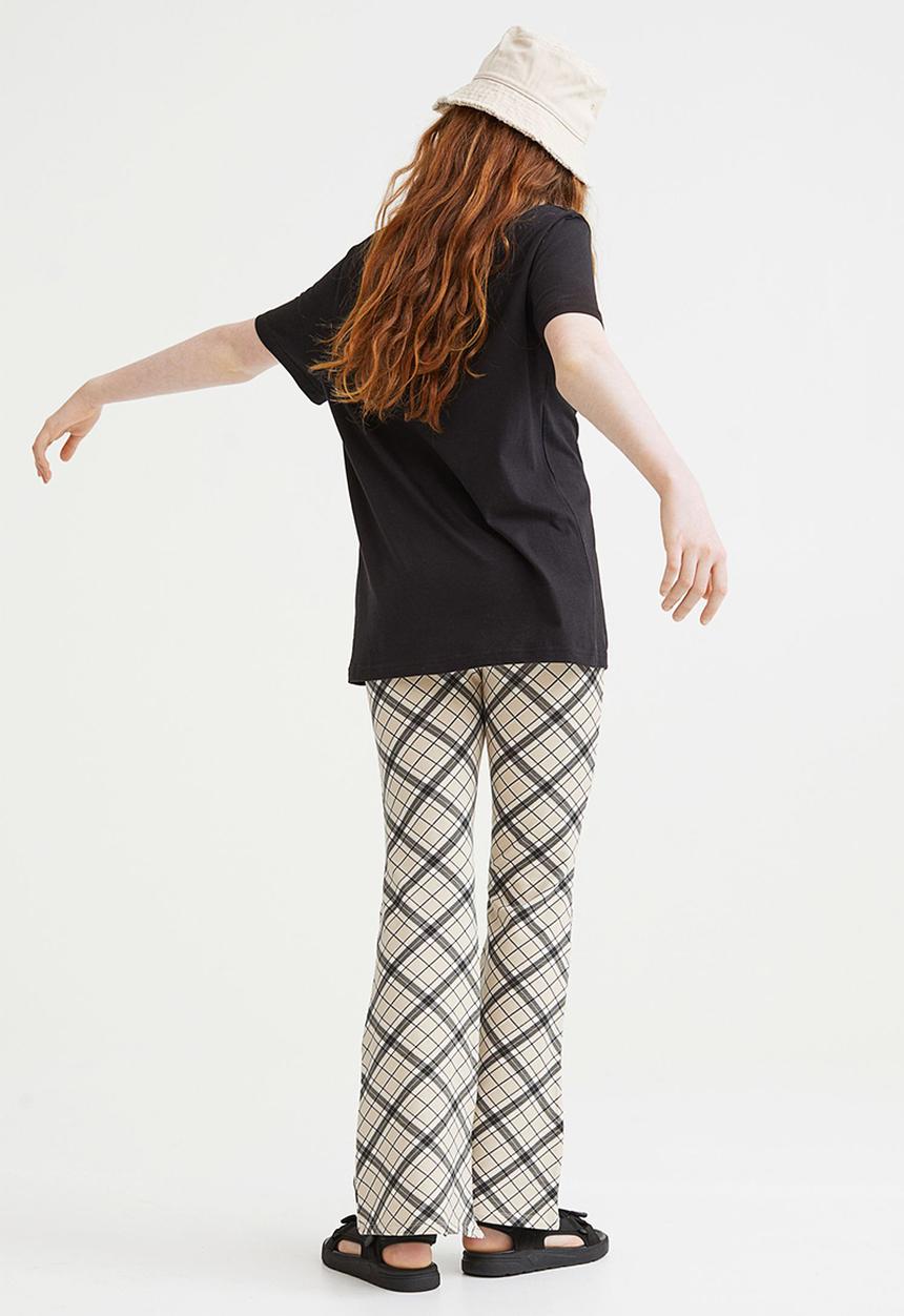 H&M - Flared leggings - beige/checked