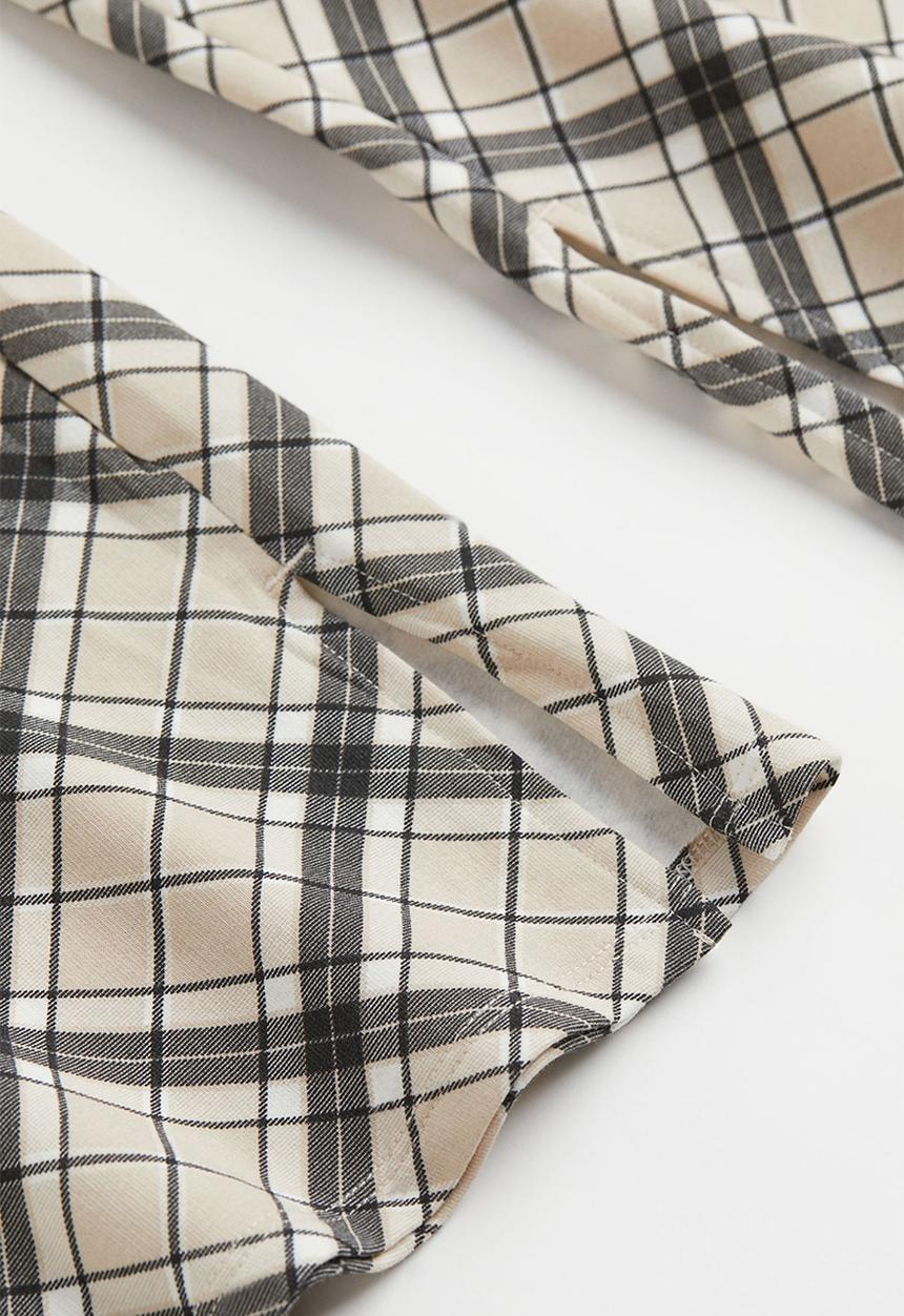 H&M - Flared leggings - beige/checked