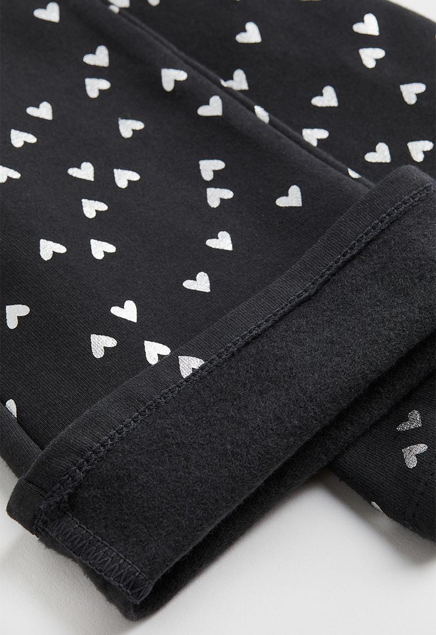H&M - Flared leggings - black/hearts