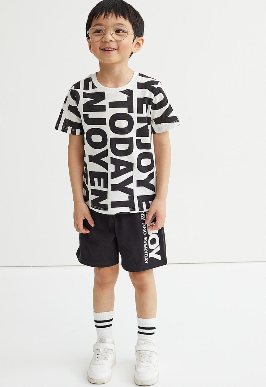 H&M - Jersey shorts - black/enjoy today