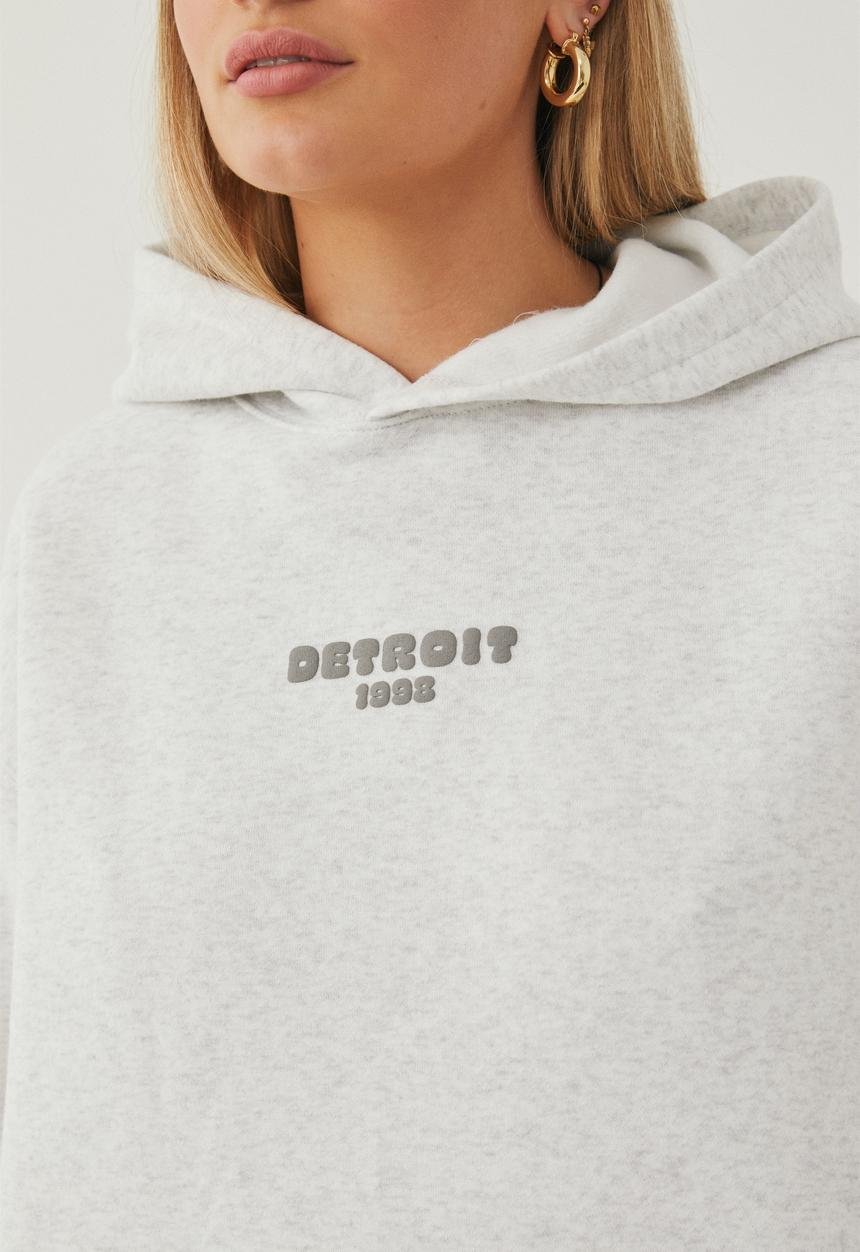 Supré  - Paige oversized printed hoodie - light grey marle/detroit