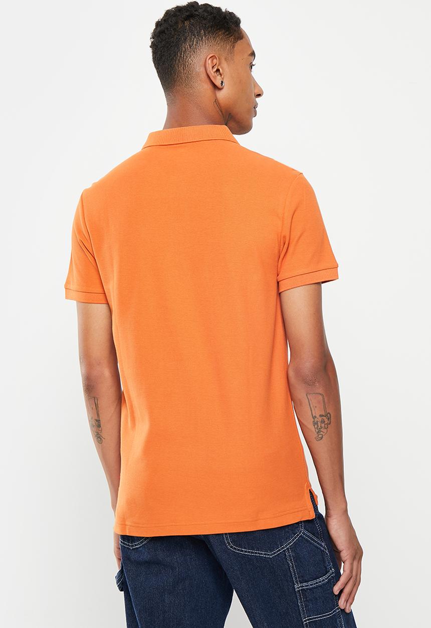 Levi’s® - Solid polo - burnt orange 