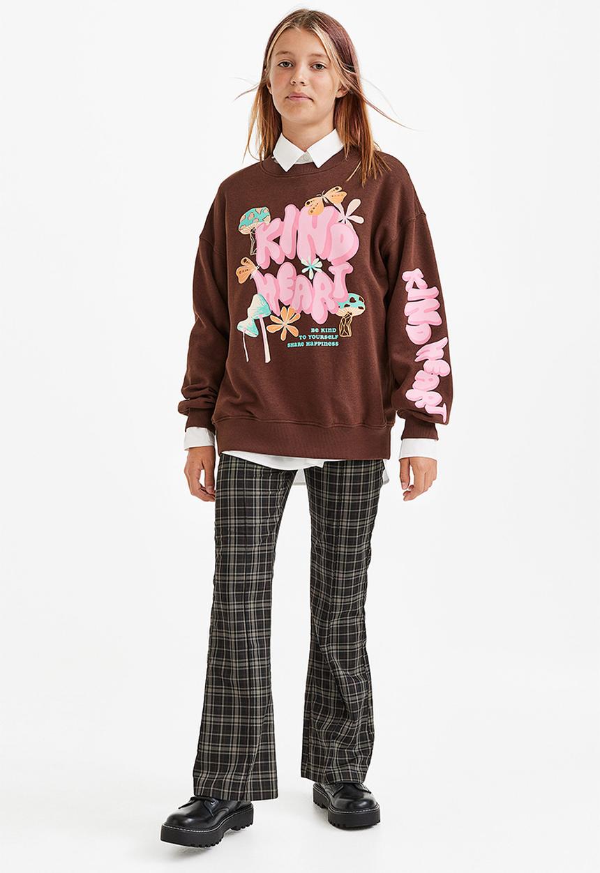 H&M - Flared tailored trousers - black/checked