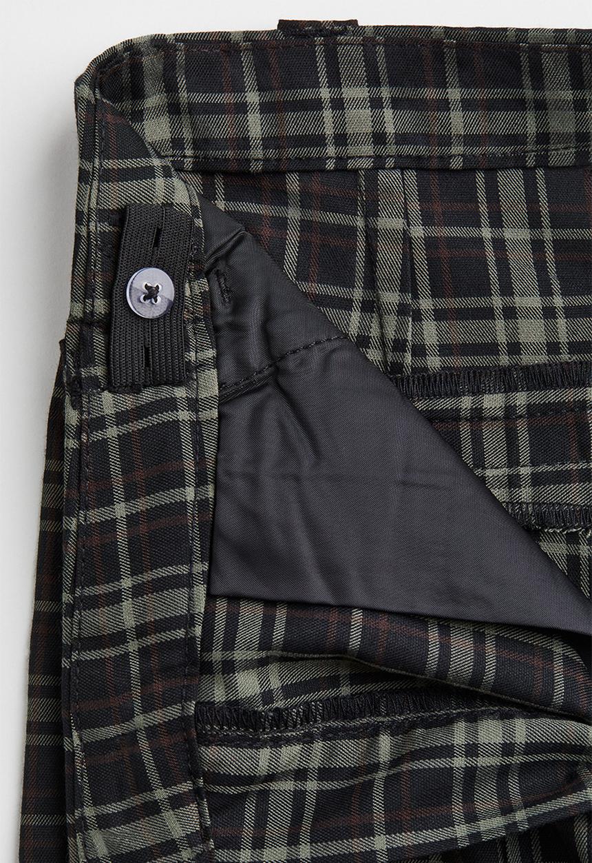 H&M - Flared tailored trousers - black/checked
