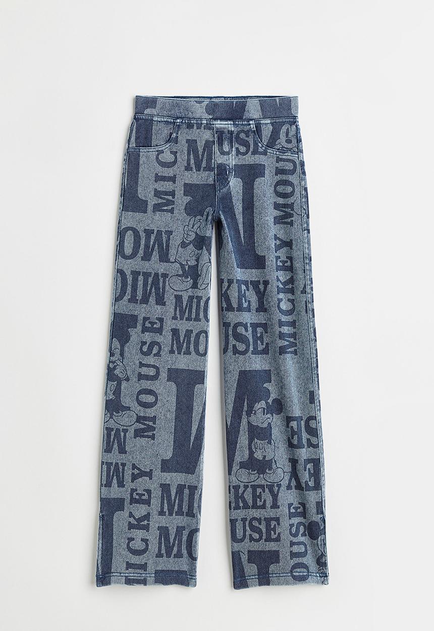 H&M - Wide printed jeggings - denim blue/mickey mouse