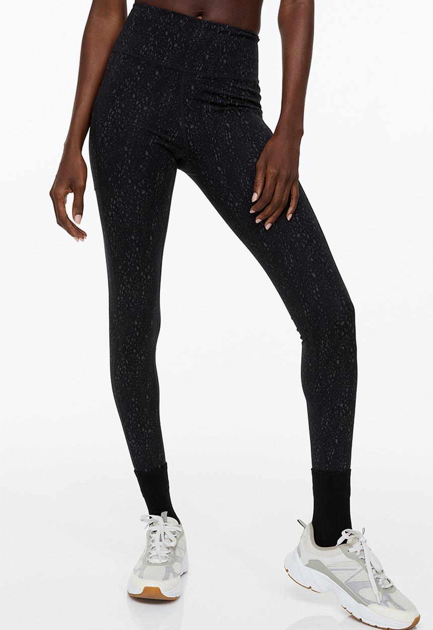 H&M - Reflective running tights - black/patterned