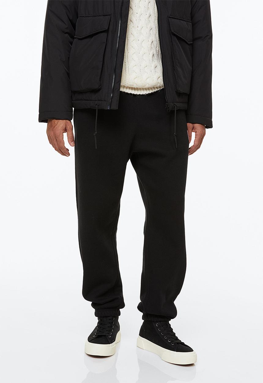 H&M - Relaxed fit sweatpants - black/new york lights